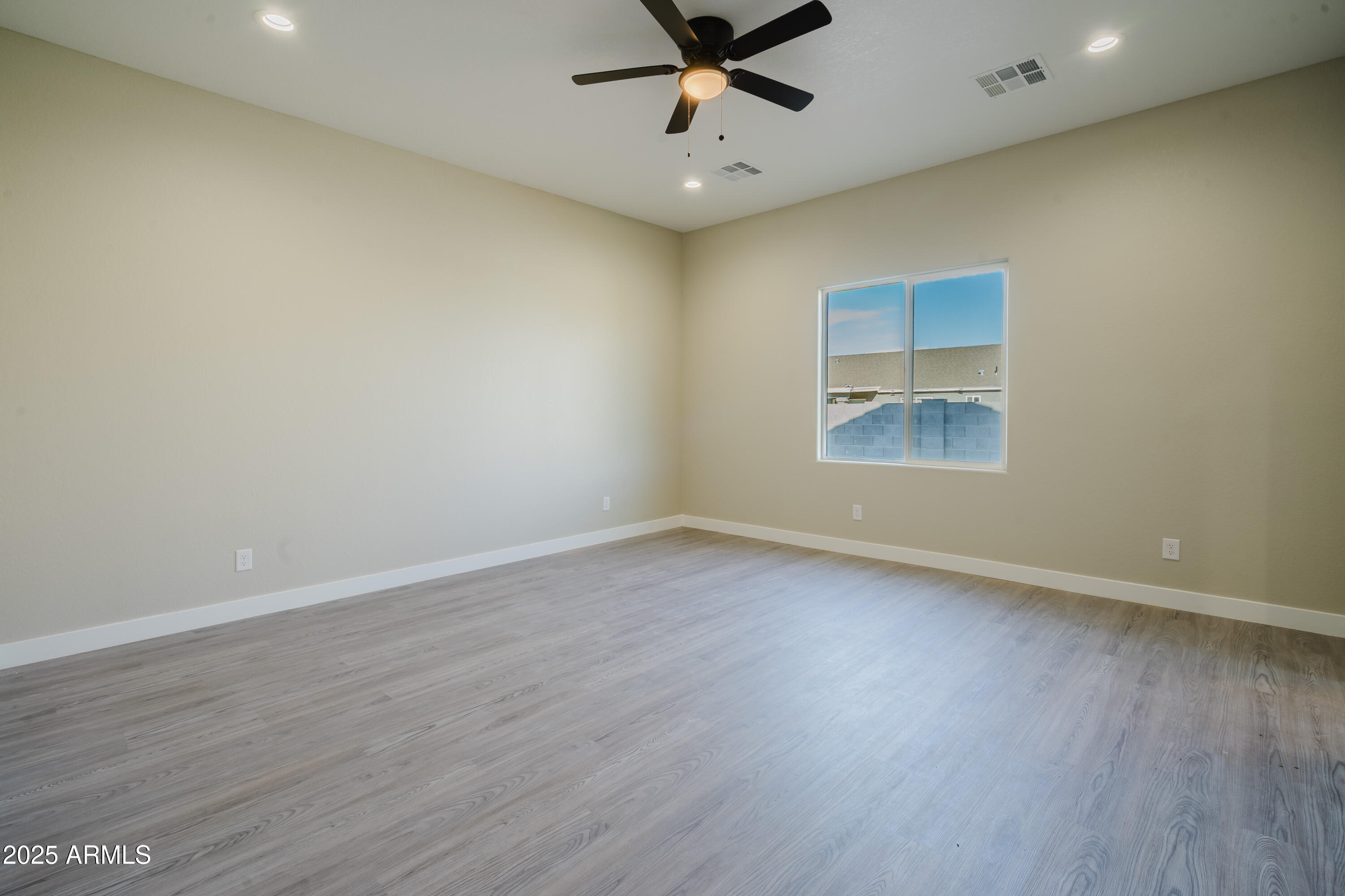 14951 South Capistrano Road Arizona City, AZ 85123 - Photo 15 of 27 wooden floor in an empty room with a window