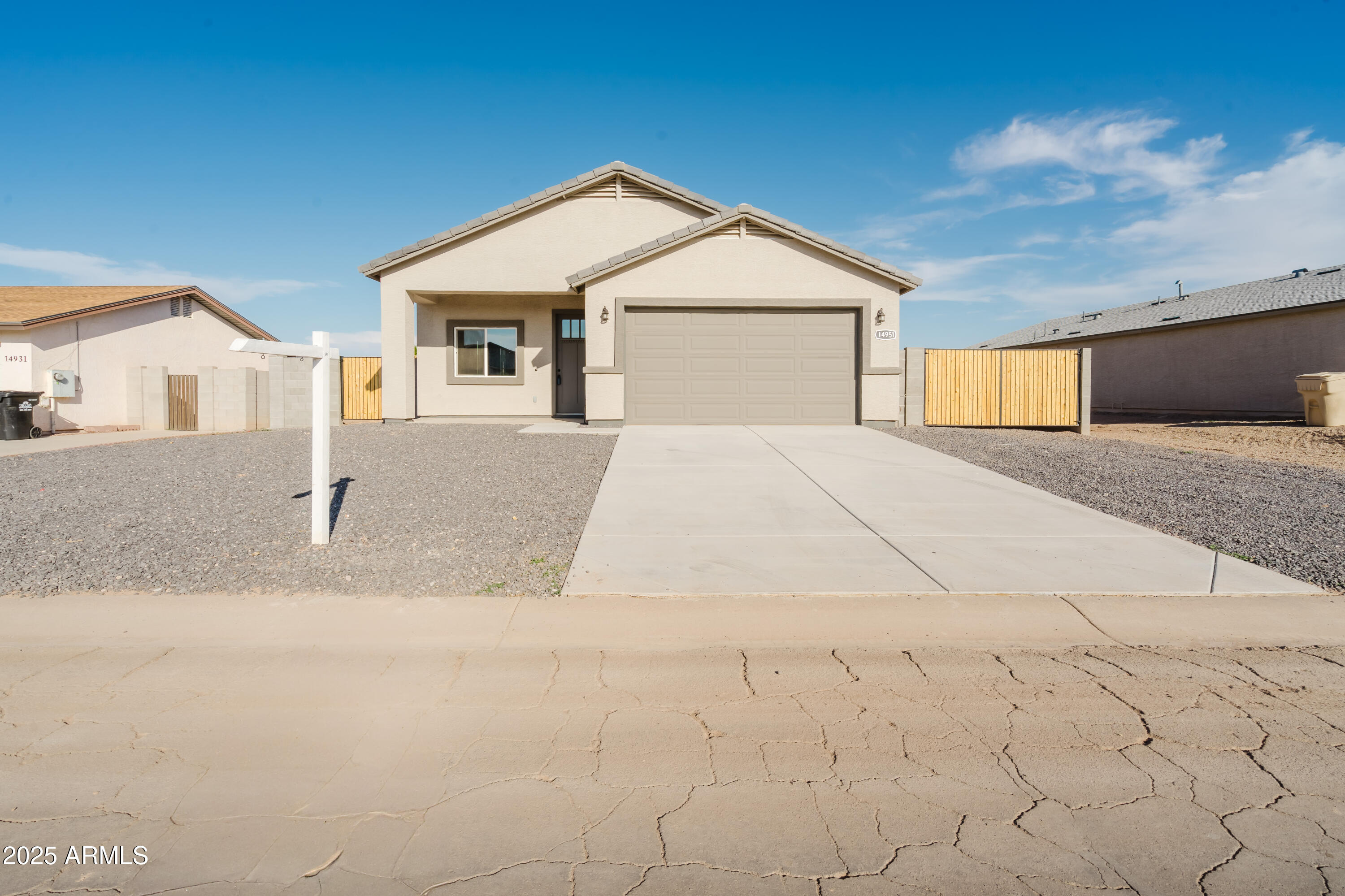 14951 South Capistrano Road Arizona City, AZ 85123 - Photo 27 of 27 a front view of a house with a yard and garage
