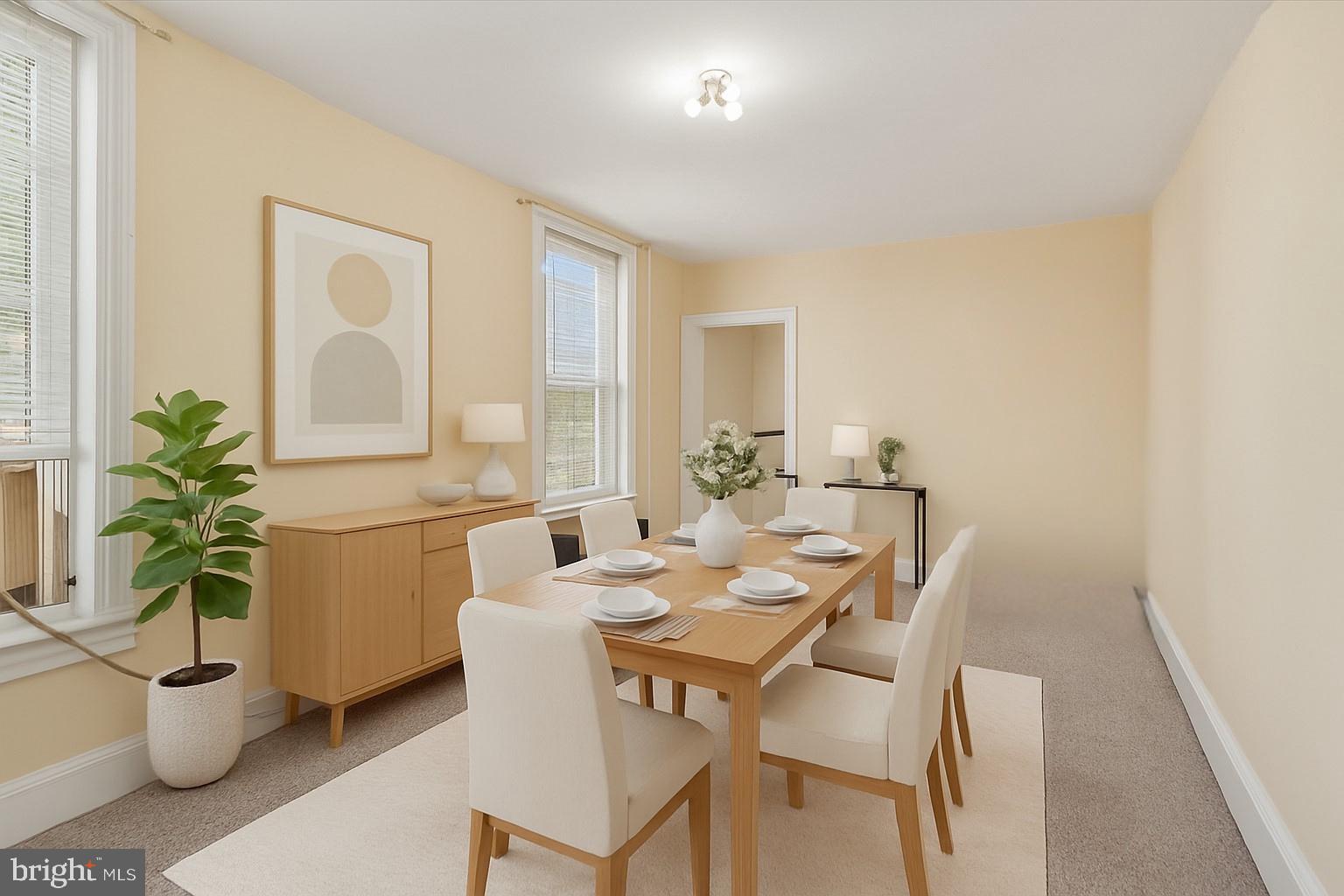 6232 Ridge Avenue Philadelphia, PA 19128 - Photo 13 of 33 a dining room with furniture and potted plants