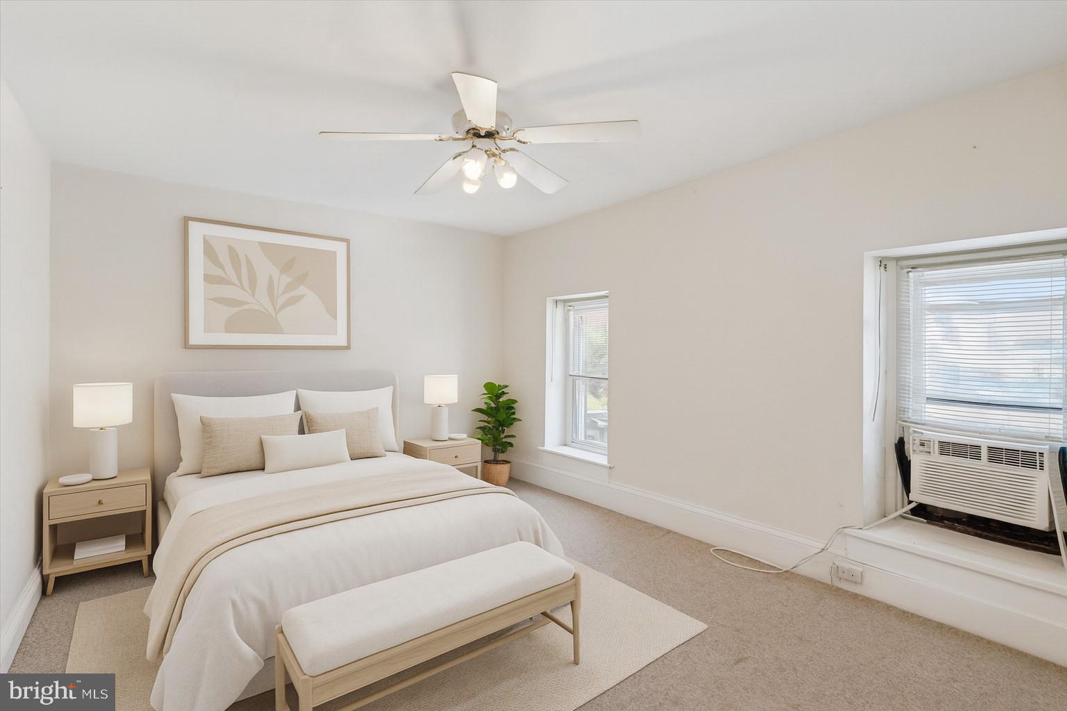 6232 Ridge Avenue Philadelphia, PA 19128 - Photo 23 of 33 a bedroom with a large bed and a chandelier