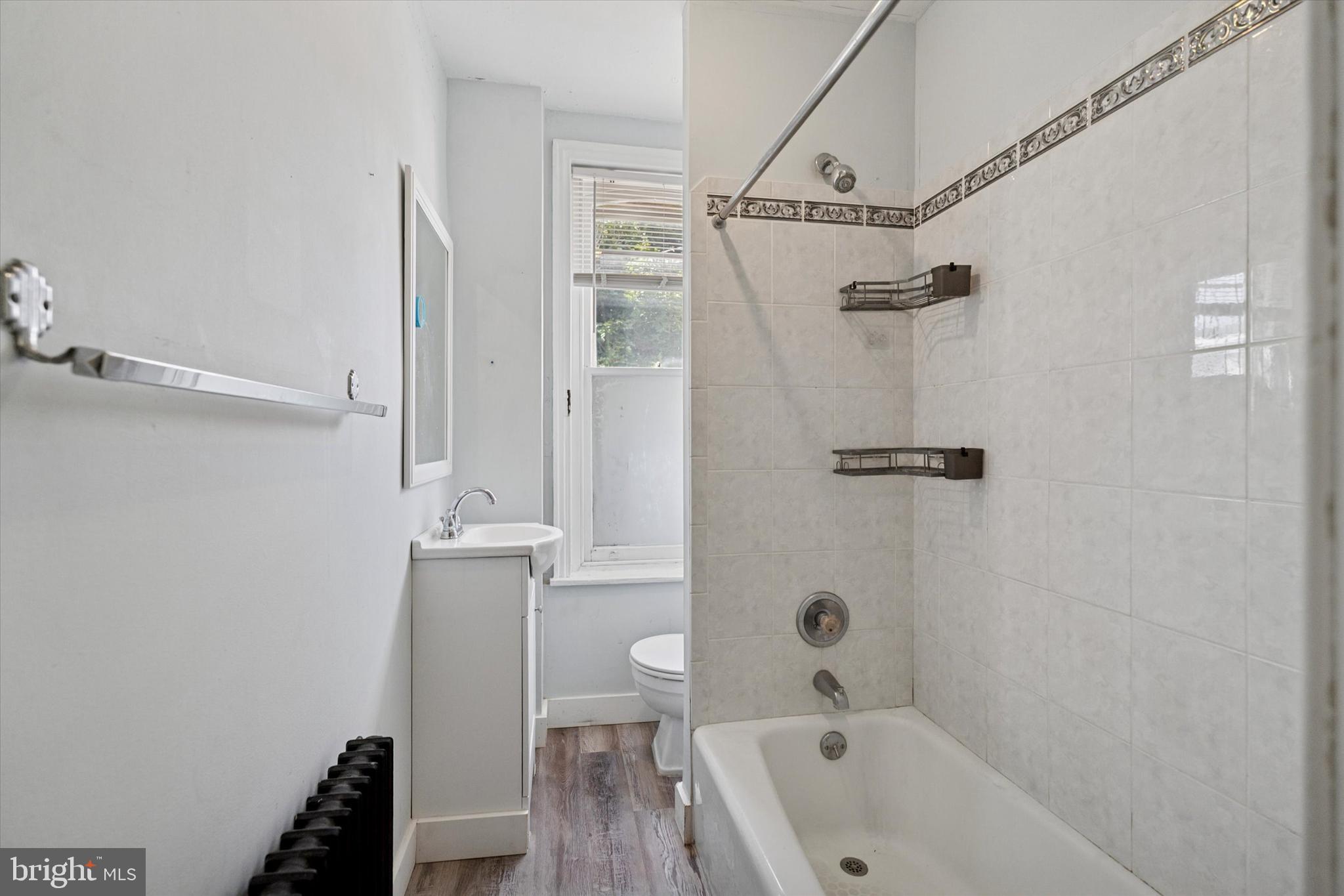6232 Ridge Avenue Philadelphia, PA 19128 - Photo 10 of 33 a bathroom with a tub a sink and a shower