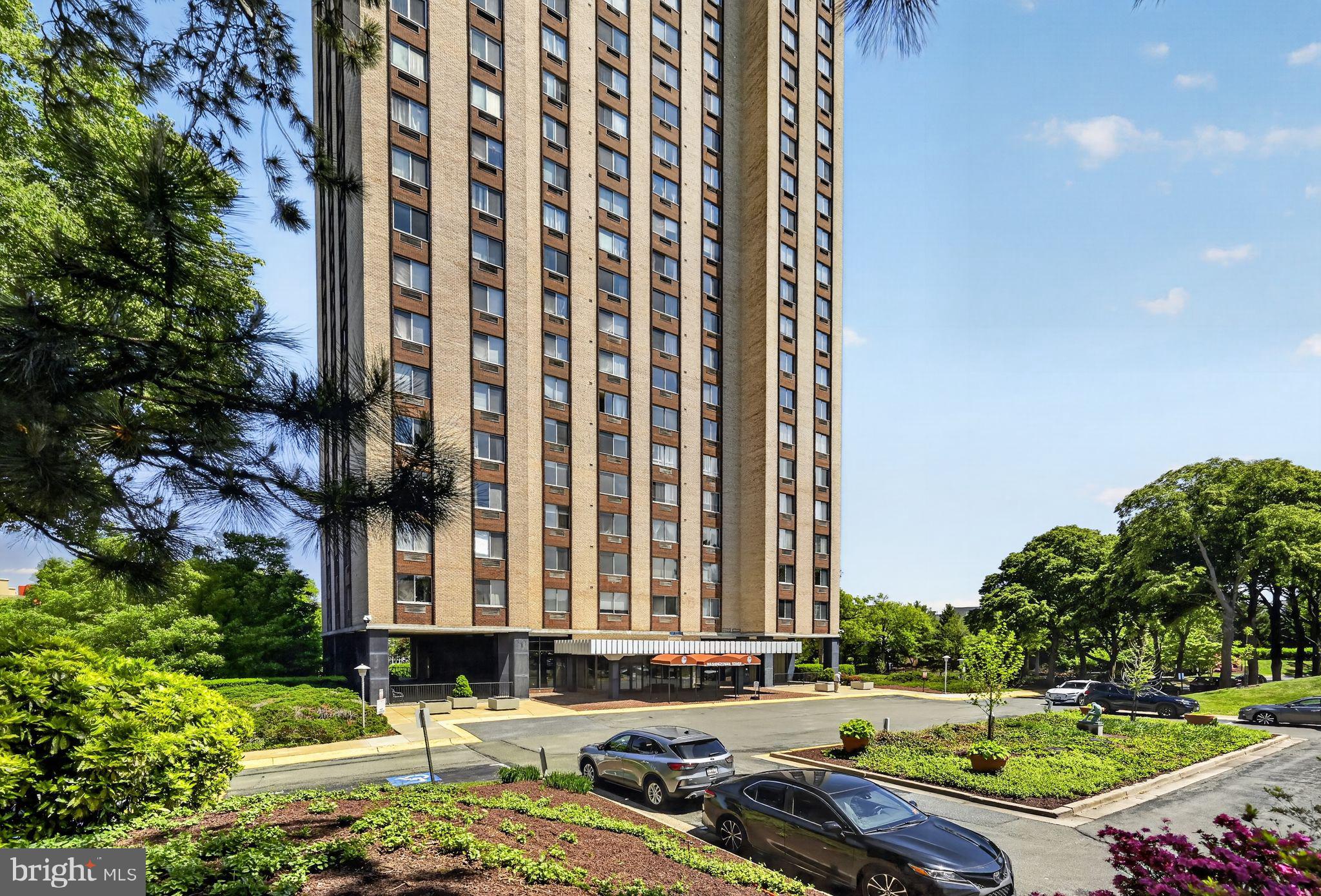 9701 Fields Road, Unit 200 Gaithersburg, MD 20878 - Photo 2 of 31 a front view of a building with yard and seating area