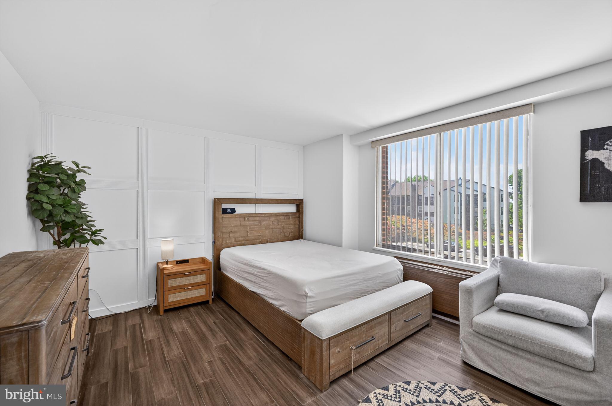 9701 Fields Road, Unit 200 Gaithersburg, MD 20878 - Photo 21 of 31 a bedroom with a bed and a couch