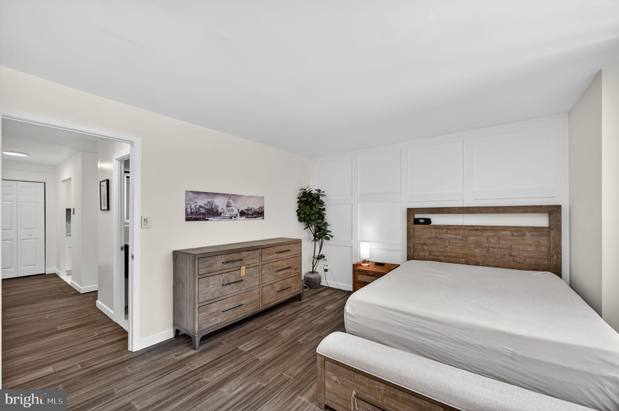 9701 Fields Road, Unit 200 Gaithersburg, MD 20878 - Photo 22 of 31 a bedroom with a bed and a dresser