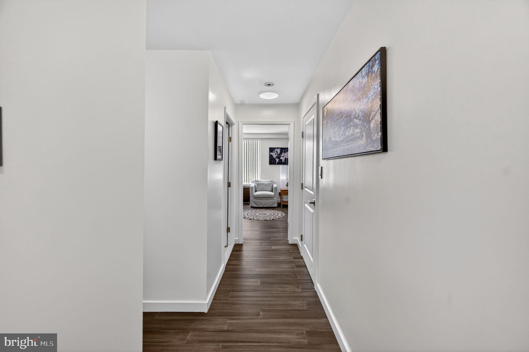 9701 Fields Road, Unit 200 Gaithersburg, MD 20878 - Photo 25 of 31 a view of a hallway with wooden floor and staircase