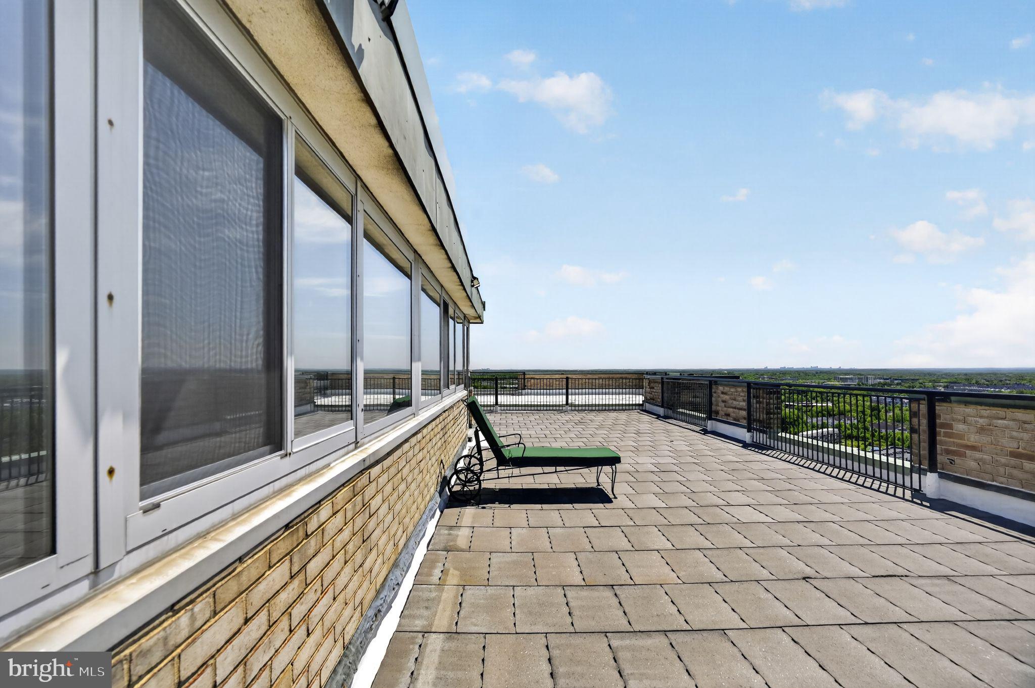 9701 Fields Road, Unit 200 Gaithersburg, MD 20878 - Photo 30 of 31 a view of a balcony with seating space