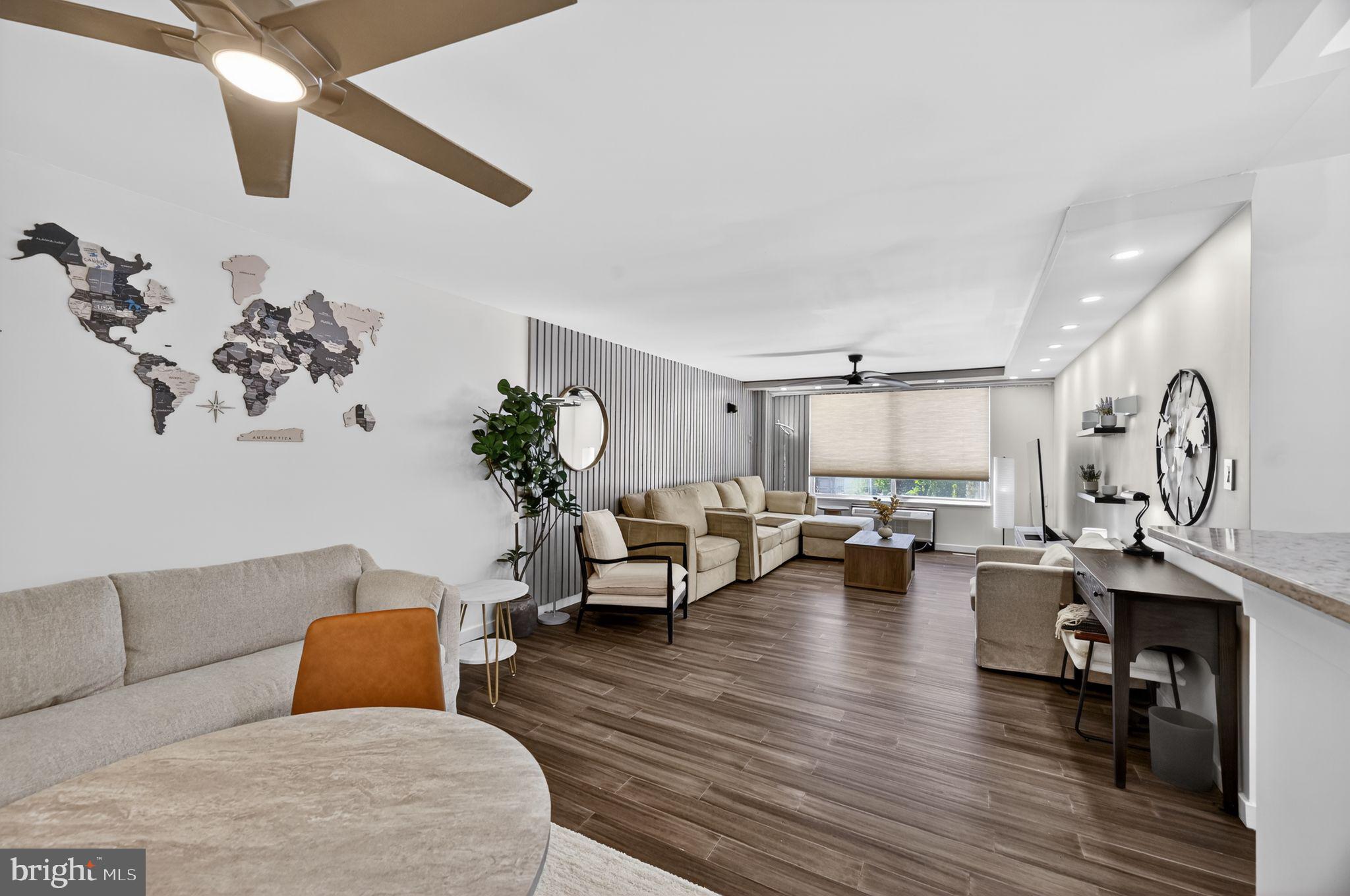 9701 Fields Road, Unit 200 Gaithersburg, MD 20878 - Photo 4 of 31 a living room with furniture and wooden floor