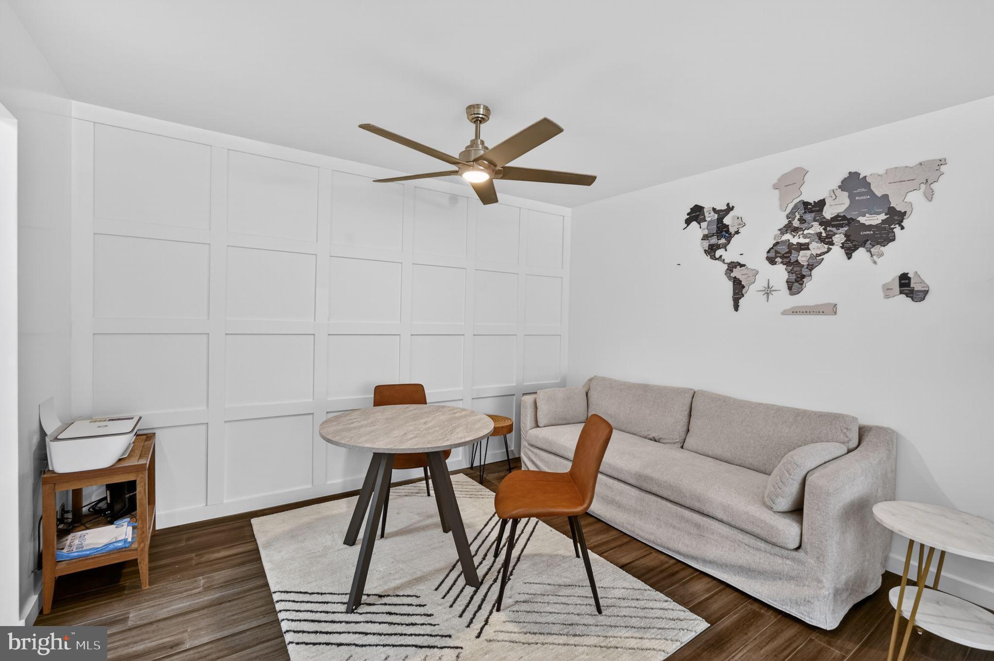 9701 Fields Road, Unit 200 Gaithersburg, MD 20878 - Photo 9 of 31 a living room with furniture and a rug