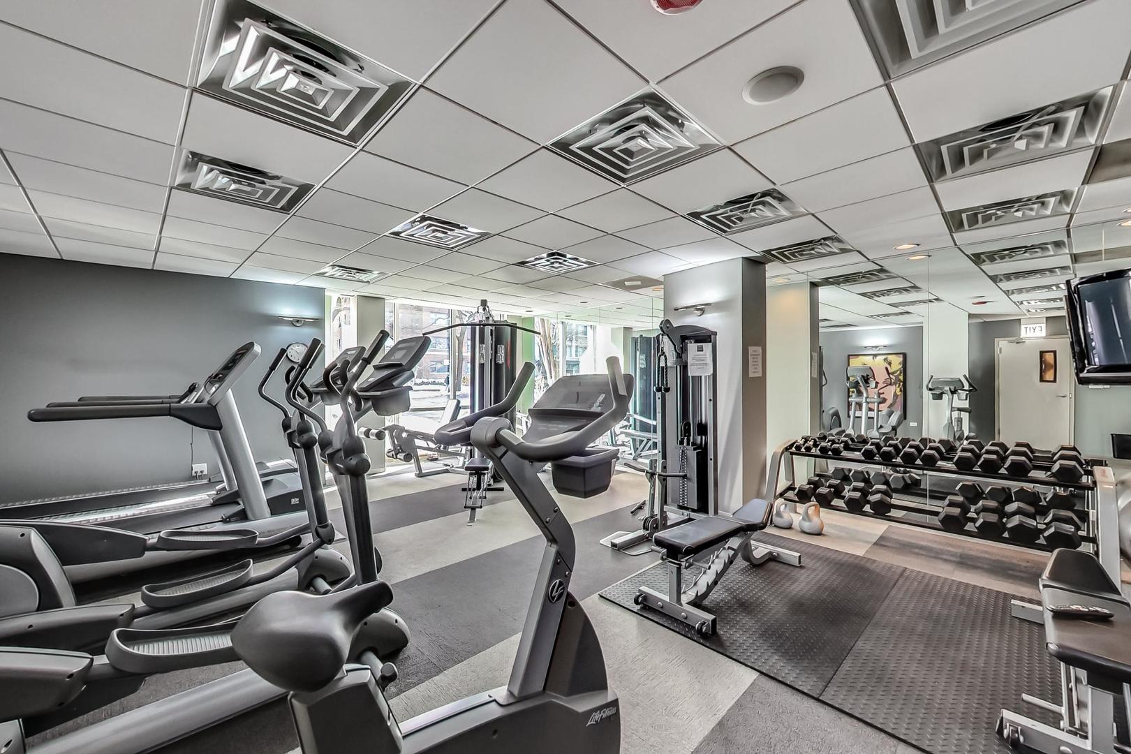2930 North Sheridan Road, Unit 702 Chicago, IL 60657 - Photo 14 of 25 a view of a room with gym equipment