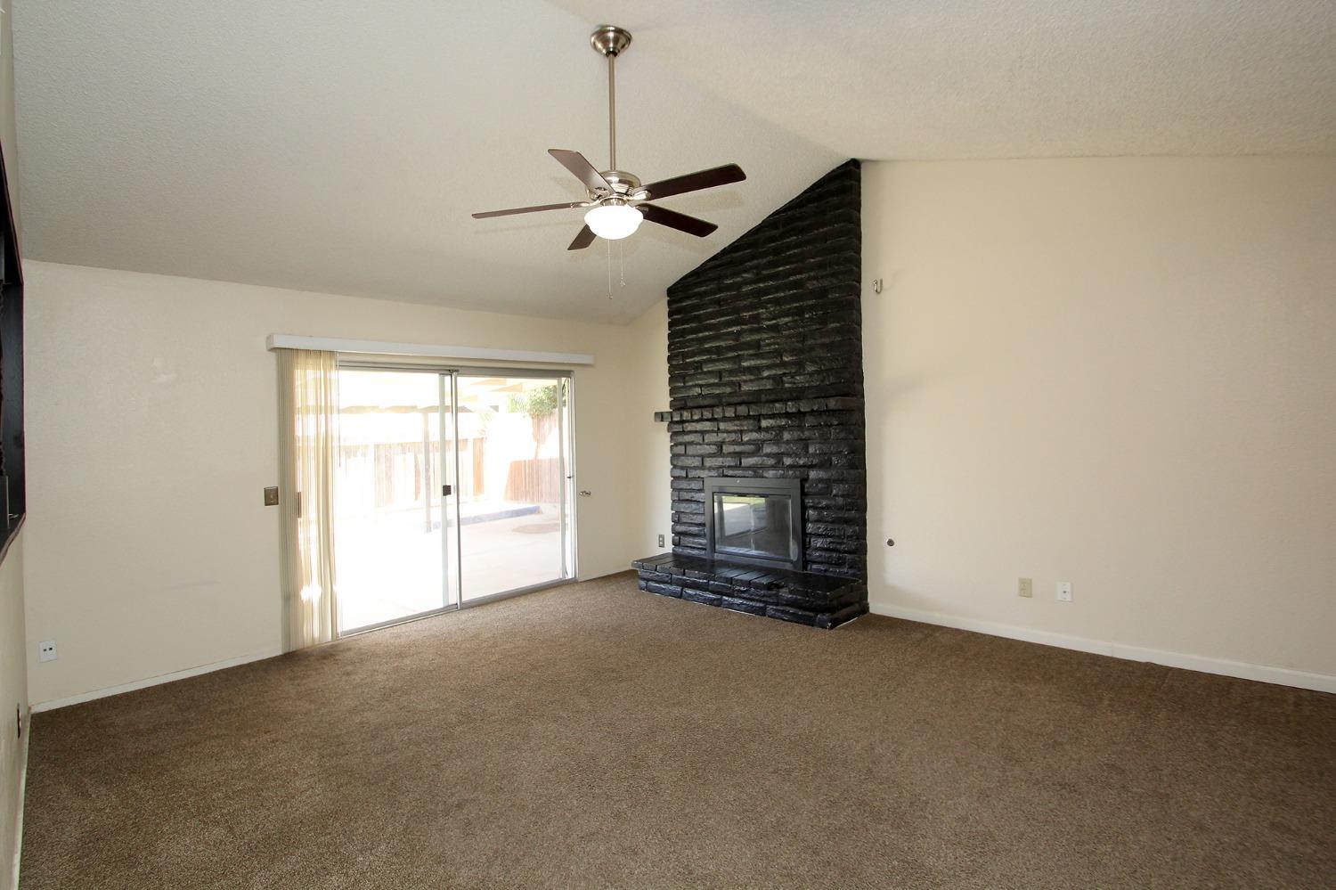 834 Fordham Avenue Clovis, CA 93611 - Photo 2 of 26 a view of an empty room with a window