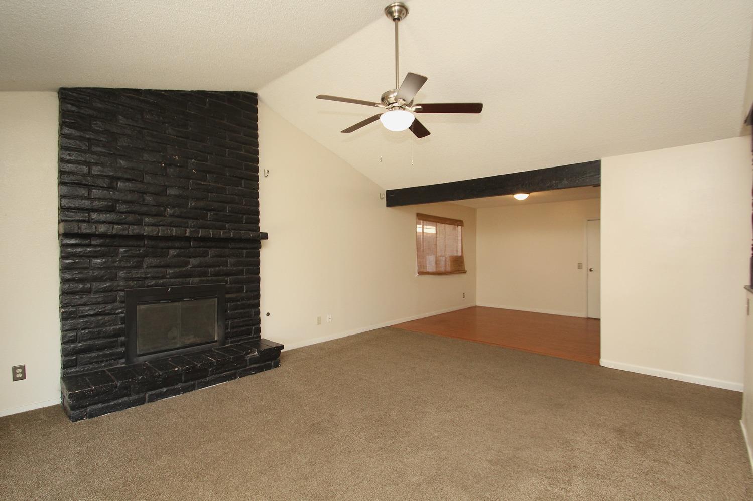 834 Fordham Avenue Clovis, CA 93611 - Photo 3 of 26 a view of an empty room and fire place