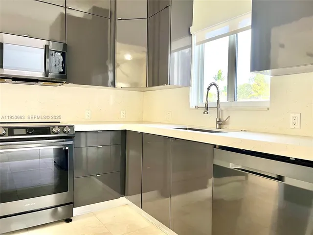 a view of a pathway of a house with wooden fence
