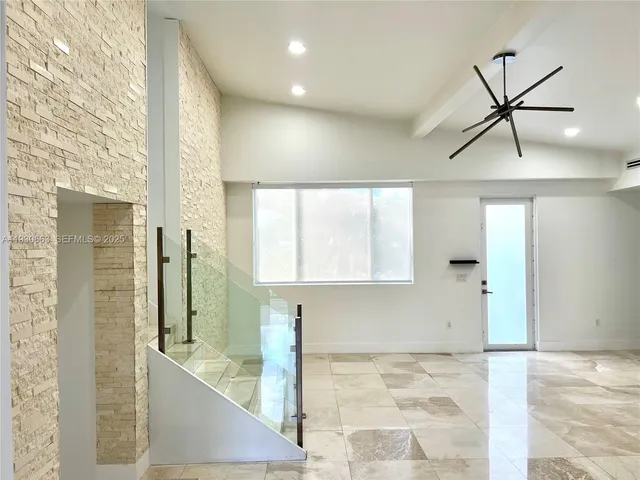 a white bath tub sitting next to a white toilet