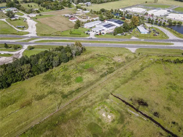 a view of a swimming pool with a yard