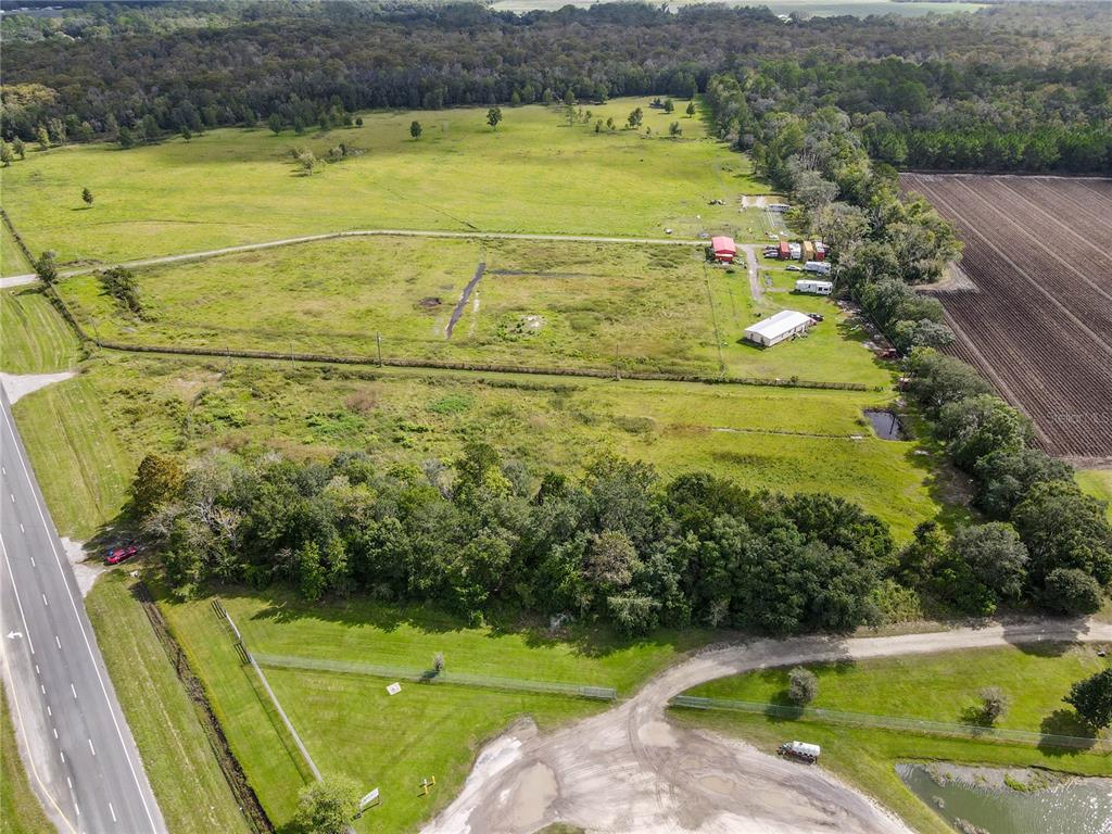 8140 State Road 207 Hastings, FL 32145 - Photo 34 of 41 a view of a swimming pool with a yard