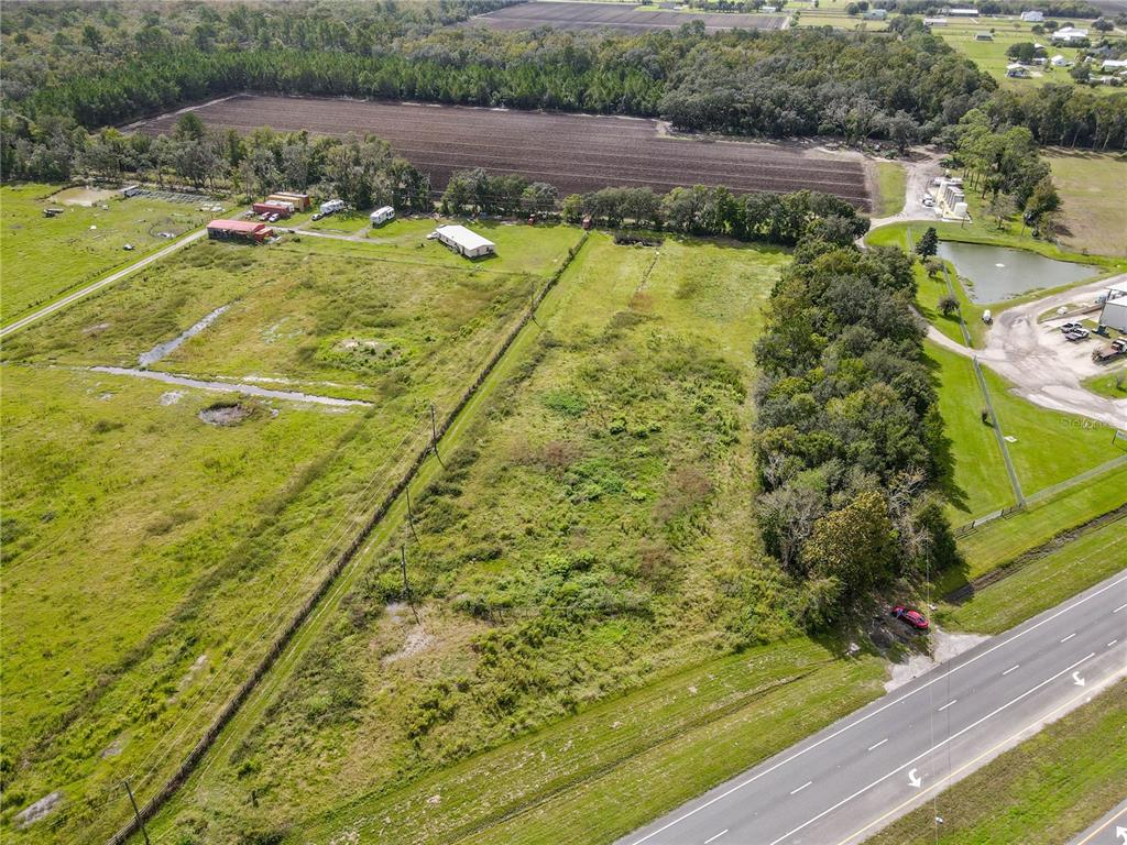 8140 State Road 207 Hastings, FL 32145 - Photo 8 of 41 a view of a yard with an umbrella