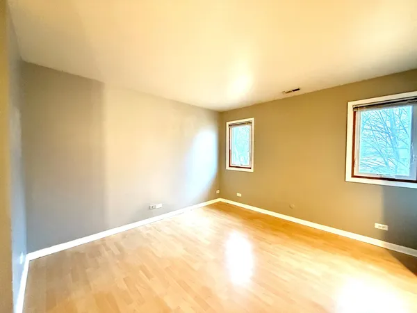 a view of a big room with windows