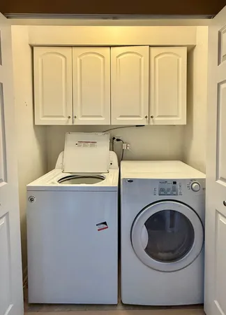 a utility room with a sink washer and dryer