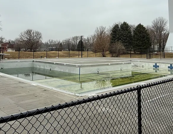 a view of a backyard with swimming pool
