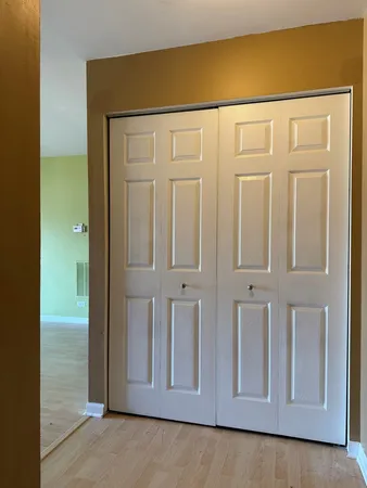 hallway view with wooden floor