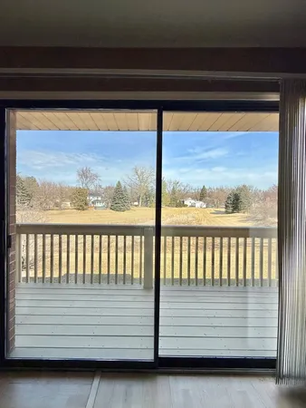 a view of balcony with furniture