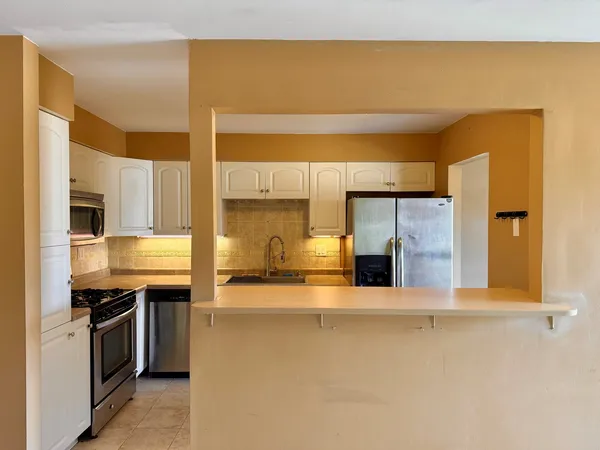 a view of a kitchen with a sink
