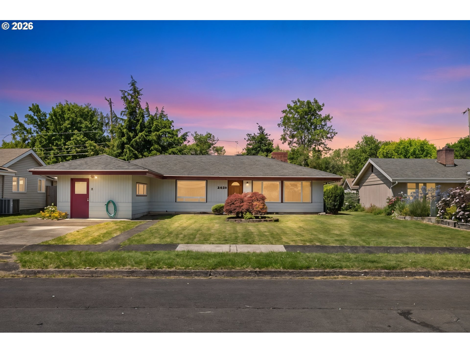 2840 Ferry Street Eugene, OR 97405 - Photo 1 of 35 a front view of a house with a yard and garage