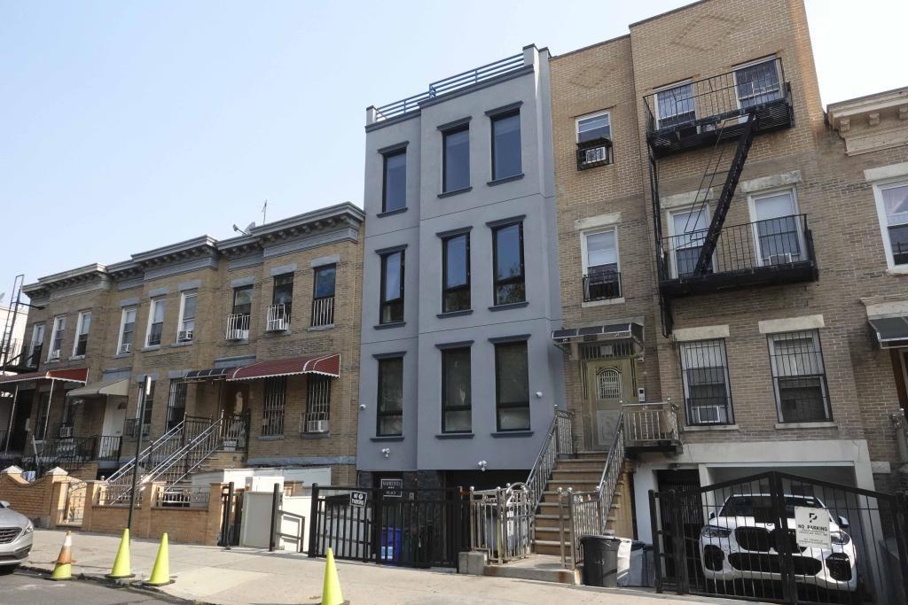 621 48th Street Brooklyn, NY 11220 - Photo 1 of 14 a front view of a building with street