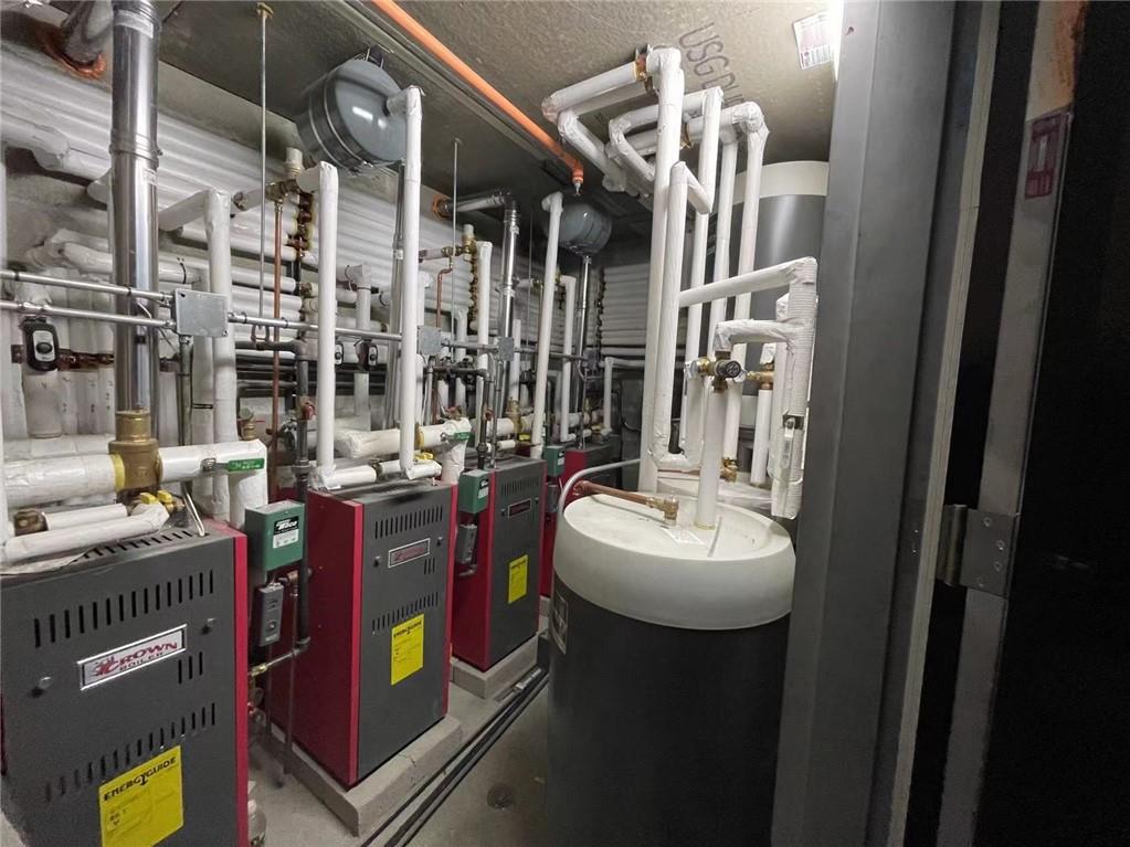 621 48th Street Brooklyn, NY 11220 - Photo 14 of 14 a bathroom with sink and mirror