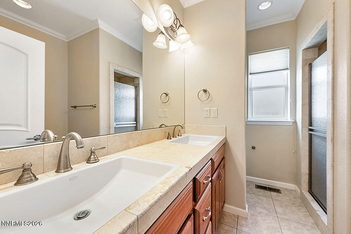 402 Chianti Way Dayton, NV 89403 - Photo 20 of 29 a bathroom with a tub sink and mirror