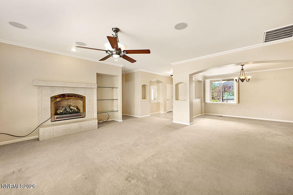 402 Chianti Way Dayton, NV 89403 - Photo 4 of 29 a view of a livingroom with fireplace and window