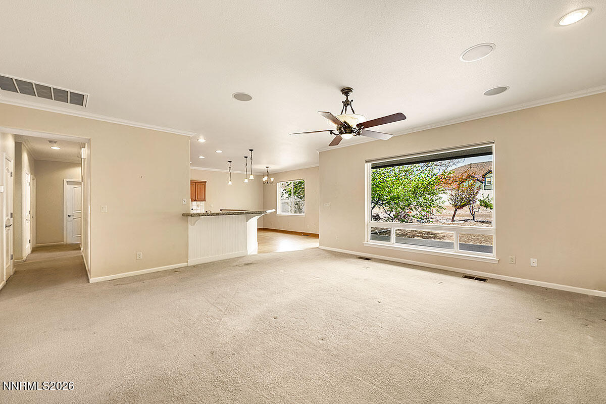 402 Chianti Way Dayton, NV 89403 - Photo 6 of 29 an empty room with a kitchen and a window