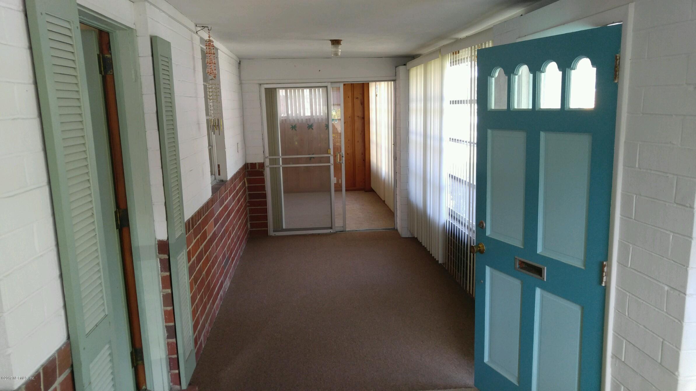 2344 Bayview Road Jacksonville, FL 32210 - Photo 2 of 6 a view of a hallway with windows and stairs