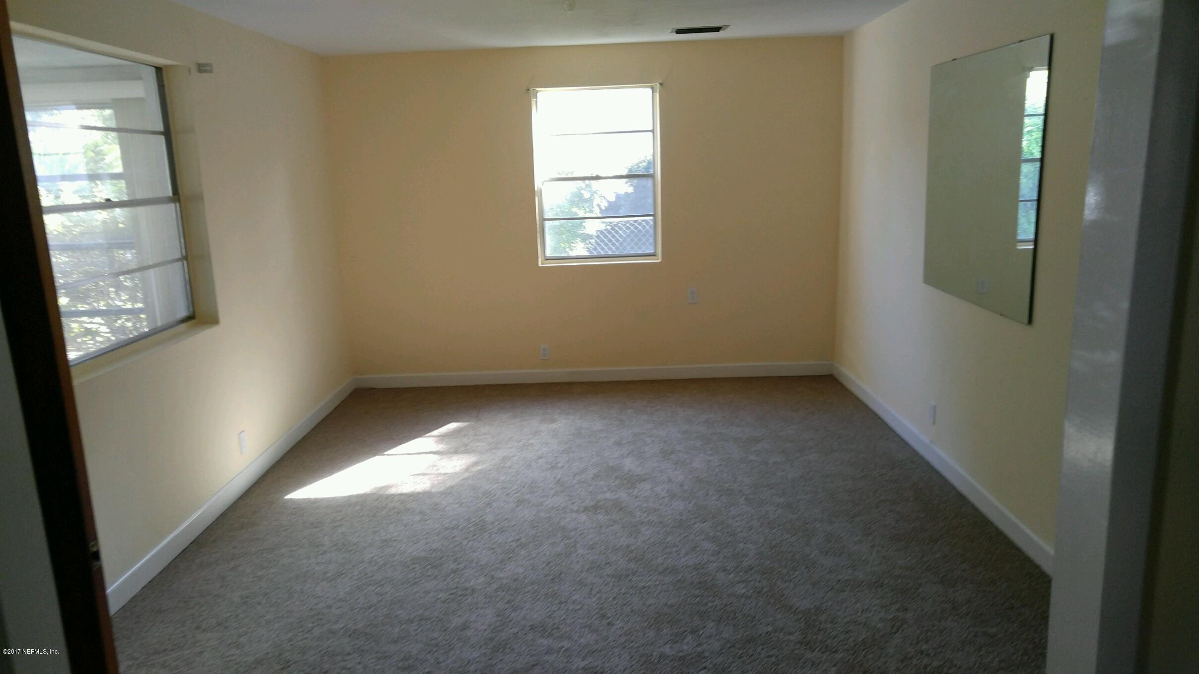 2344 Bayview Road Jacksonville, FL 32210 - Photo 3 of 6 an empty room with windows