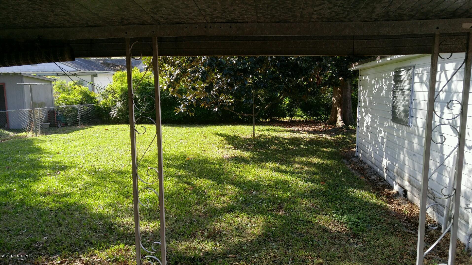 2344 Bayview Road Jacksonville, FL 32210 - Photo 5 of 6 a view of a backyard with a garden