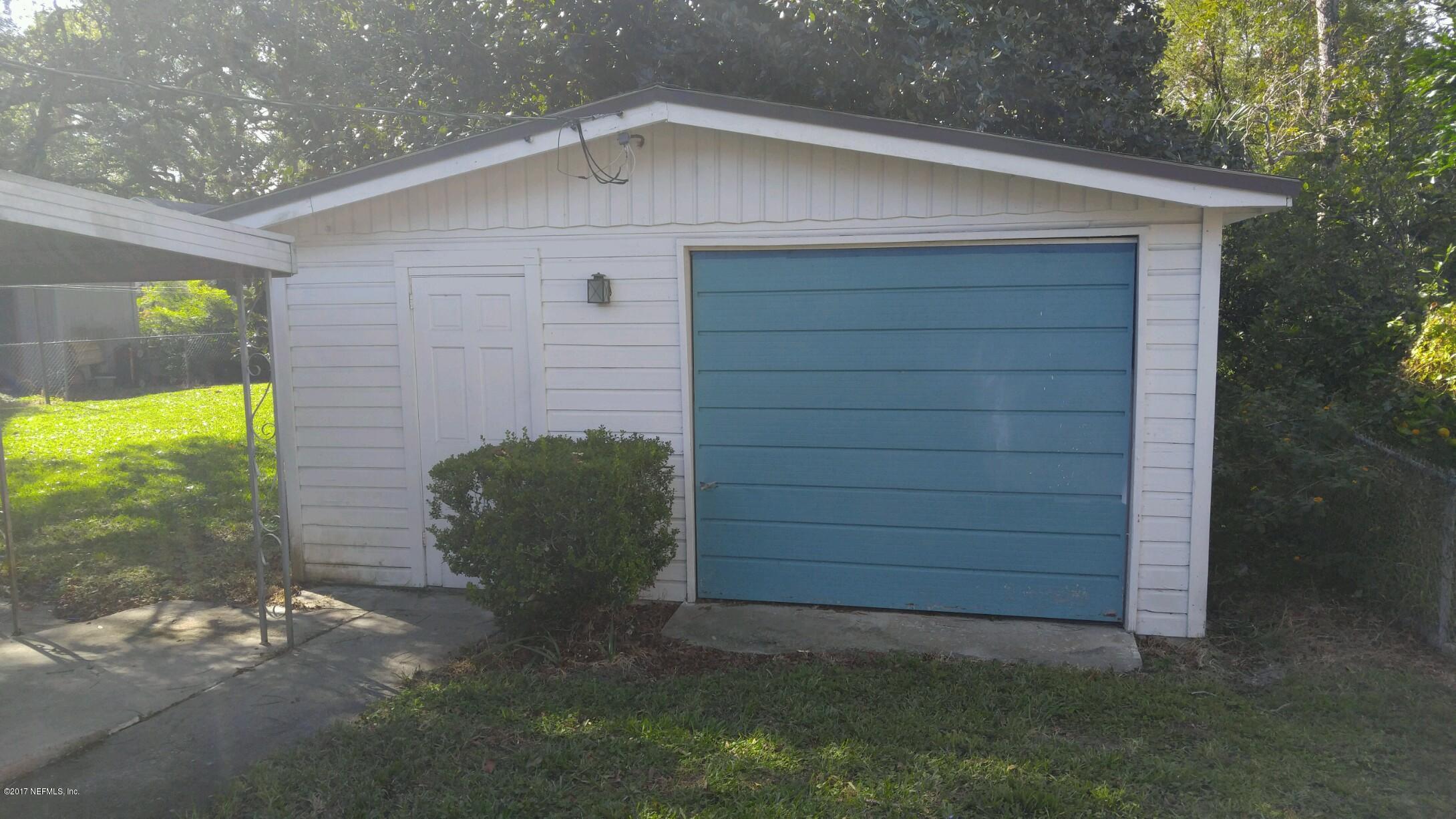 2344 Bayview Road Jacksonville, FL 32210 - Photo 6 of 6 a view of a wooden door in front of house
