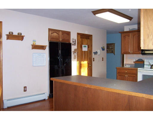 84 Walker Road Shirley, MA 01464 - Photo 8 of 30 a kitchen with stainless steel appliances granite countertop a refrigerator and a stove