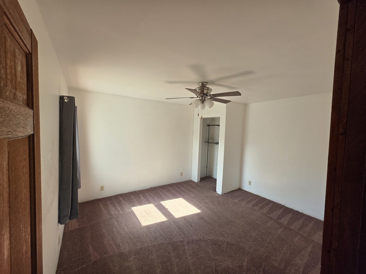 623 East Clay Street Clinton, IL 61727 - Photo 13 of 14 an empty room with a windows and closet