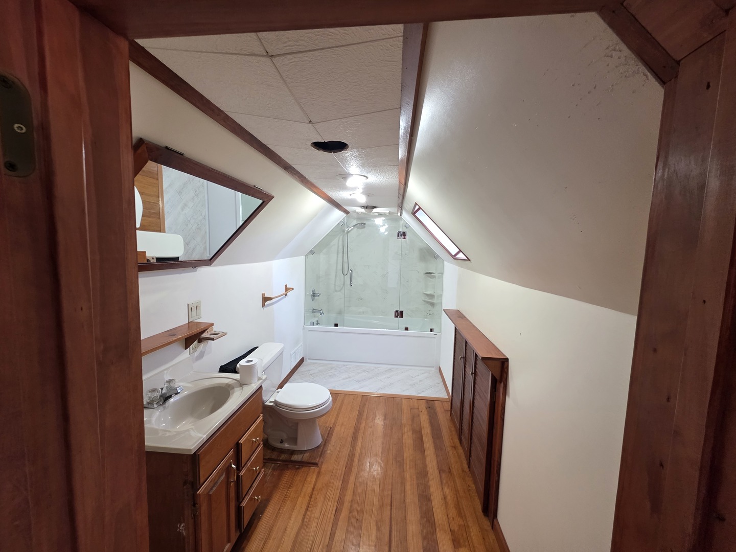623 East Clay Street Clinton, IL 61727 - Photo 14 of 14 a bathroom with a sink a toilet and a mirror