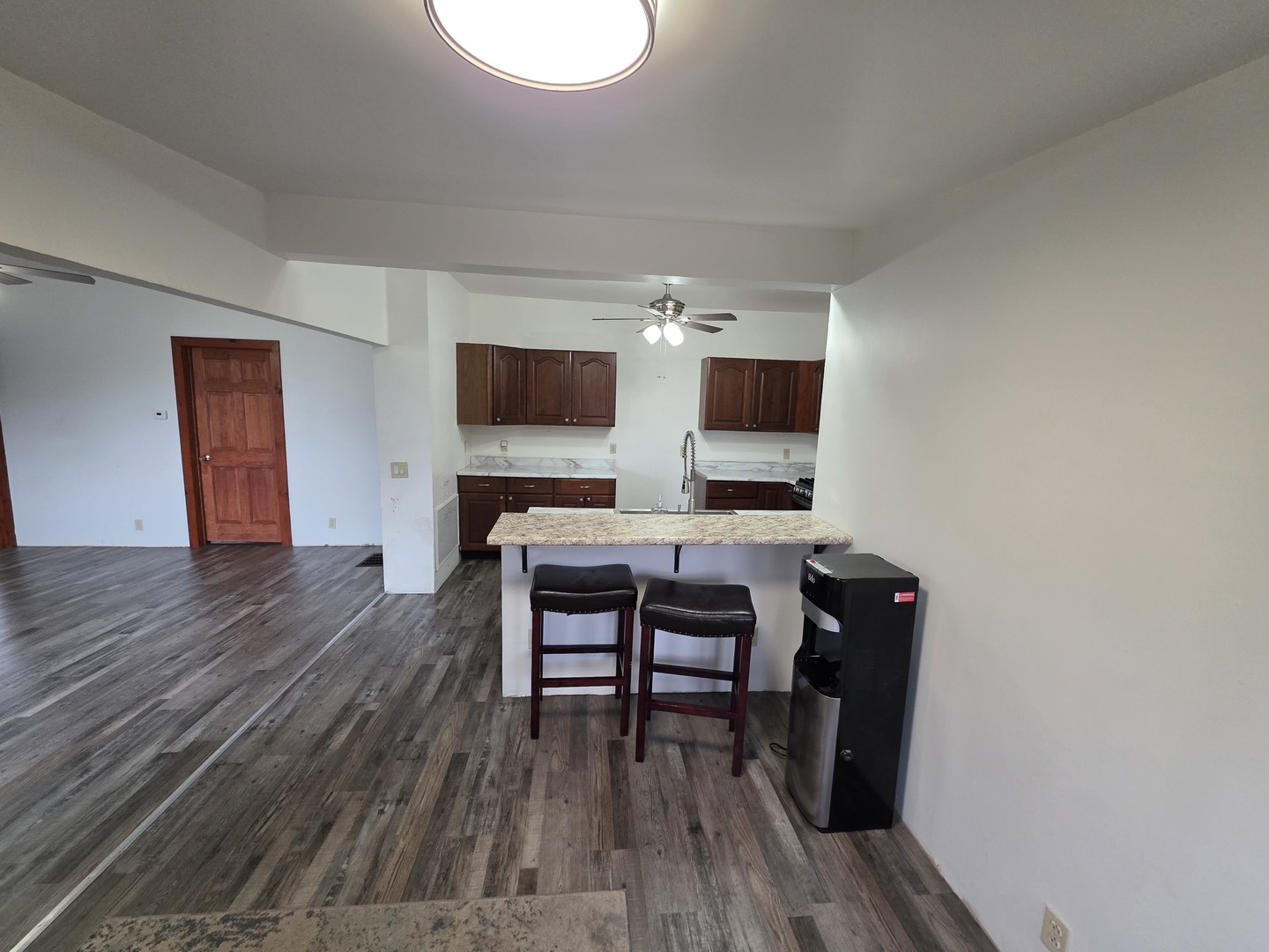 623 East Clay Street Clinton, IL 61727 - Photo 8 of 14 a view of a workspace with furniture and wooden floor