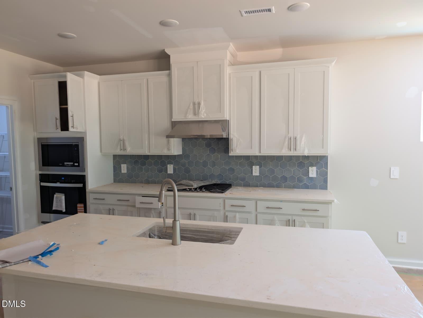 308 Karlov Road Garner, NC 27529 - Photo 6 of 55 a kitchen with stainless steel appliances granite countertop a sink a stove and a refrigerator