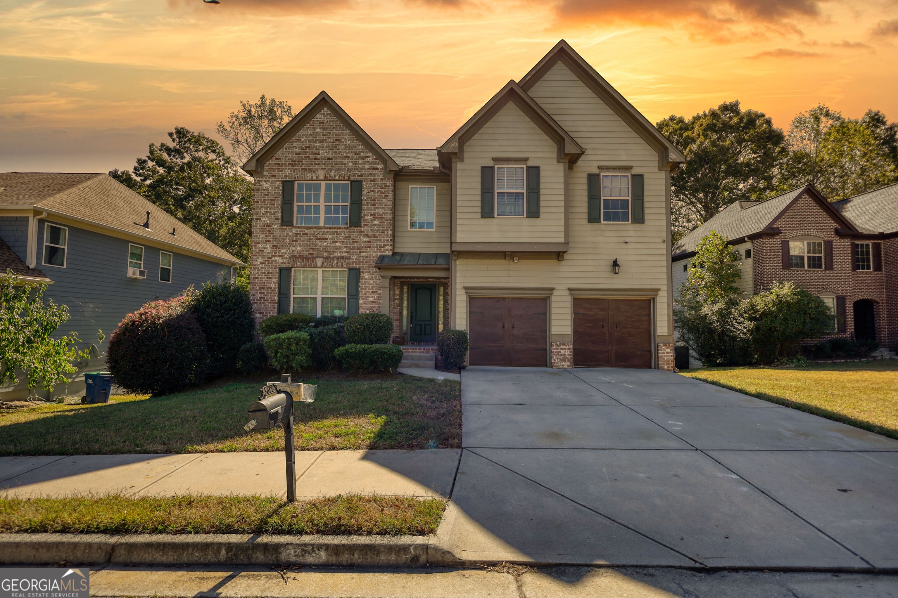 a front view of a house with garden