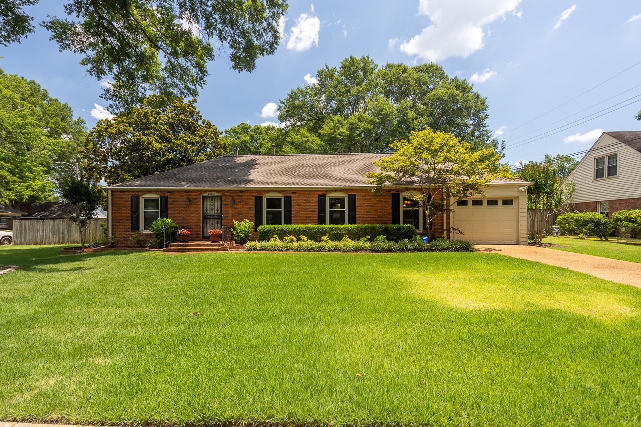 1650 Hayne Road Memphis, TN 38119 - Photo 1 of 33 a front view of a house with a garden and porch