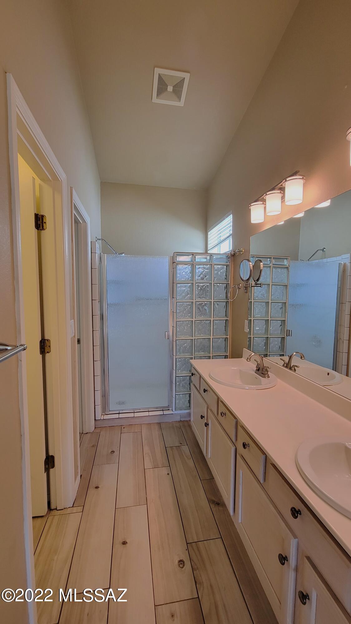 293 Valley View Drive Rio Rico, AZ 85648 - Photo 18 of 38 a spacious bathroom with a granite countertop sink a toilet a mirror and shower
