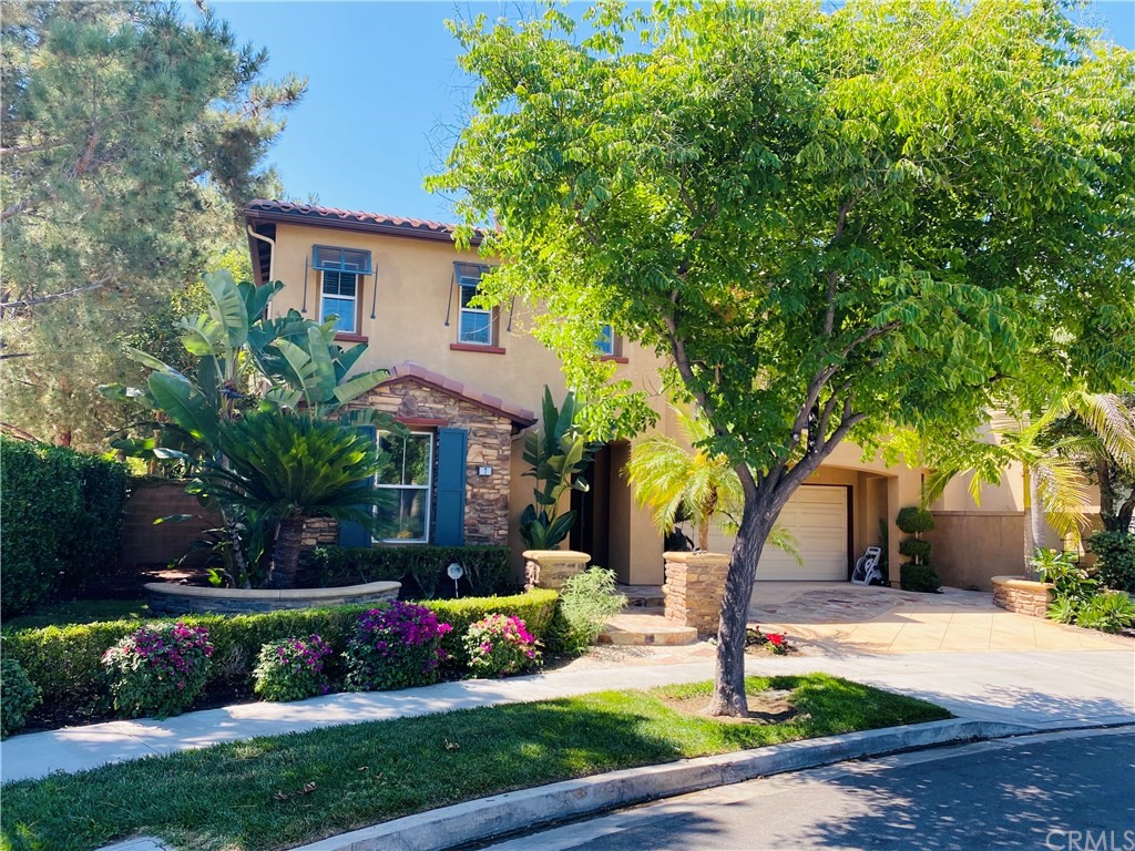 7 Dos Rios Irvine, CA 92602 - Photo 1 of 1 a front view of a house with a yard and garden
