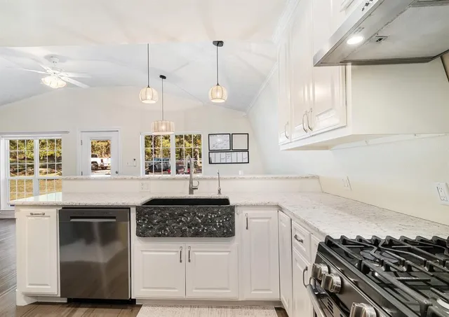 a utility room with sink washer and dryer
