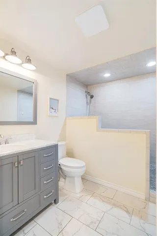 a bedroom with furniture and a baby crib