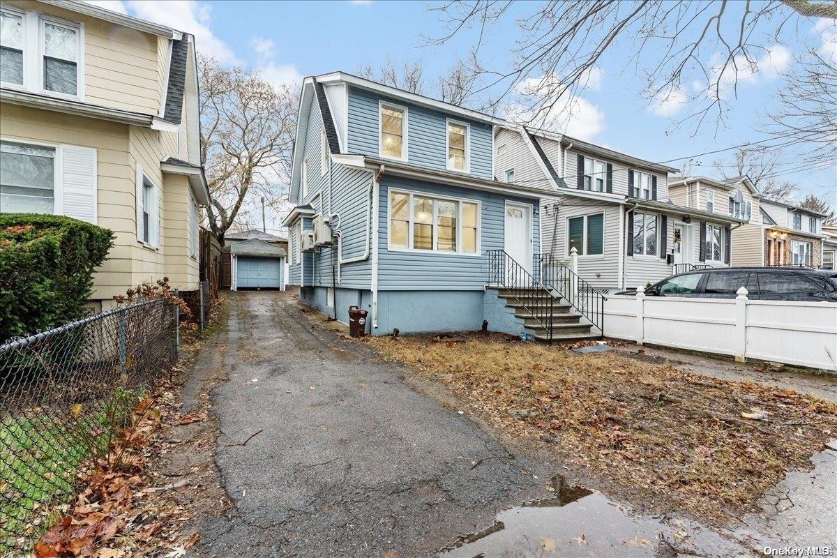 4031 Rombouts Avenue Bronx, NY 10466 - Photo 1 of 1 a front view of a house with garden