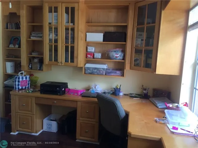 a kitchen with a cabinets and window