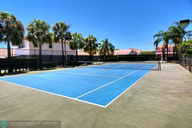 a view of a swimming pool with an outdoor space and seating area